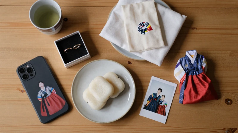 Korean cultural dating items including couple rings tea tteok and hanbok fabric representing Korean dating traditions